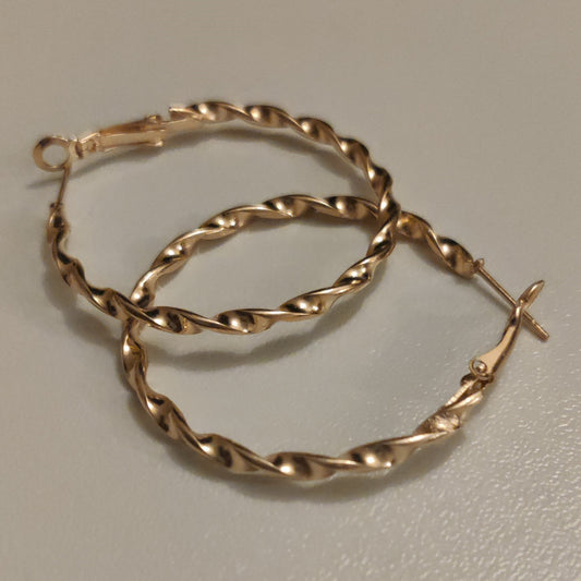 Twisted hoops Earrings | Gold